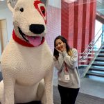 Linh Dao poses next to a lego version of the Target dog at Target HQ.